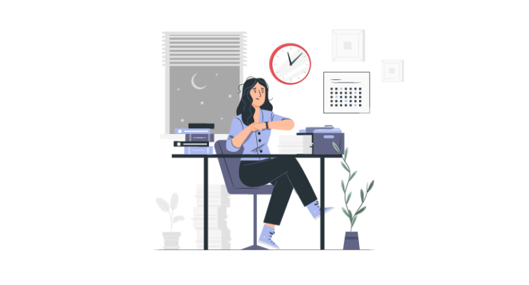 Employee working late at a desk after regular work hours, representing overtime and extended work time.