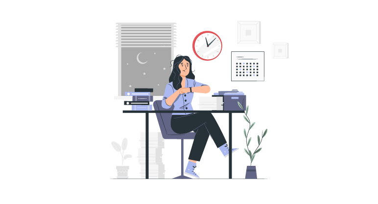 Employee working late at a desk after regular work hours, representing overtime and extended work time.